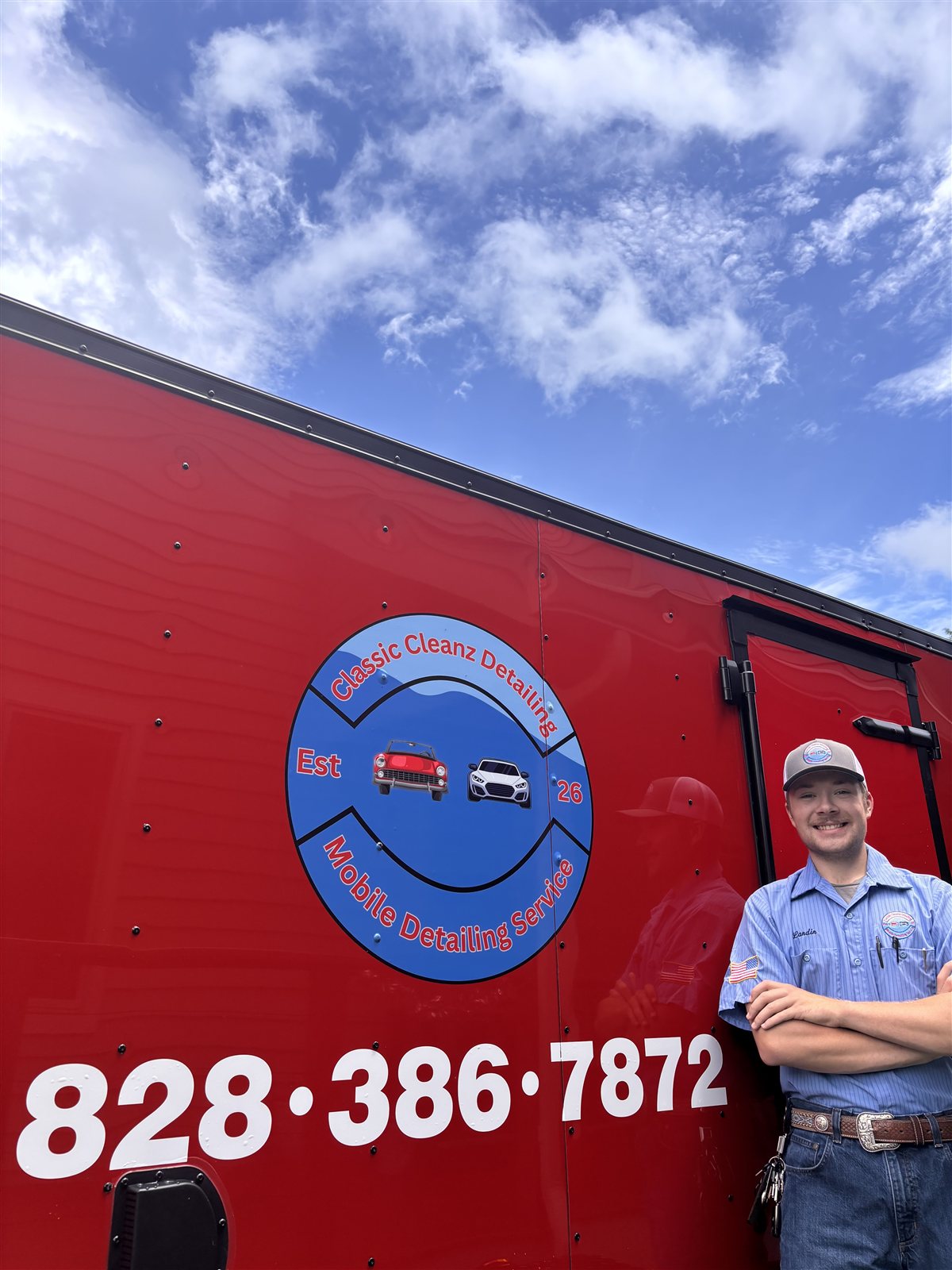 Landin Murray, owner of Classic Cleanz Detailing, with the mobile detailing trailer